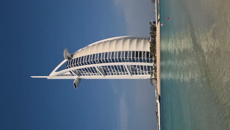 Vertical-Video,-Burl-Al-Arab-Tower-and-Hotel-on-Jumeirah-Beach,-Dubai-UAE