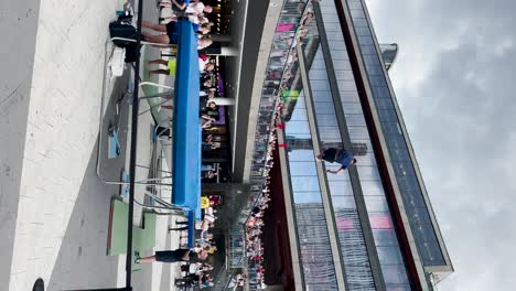 Vertical-shot-of-performer-jumping-at-trampoline-show-in-Stockholm