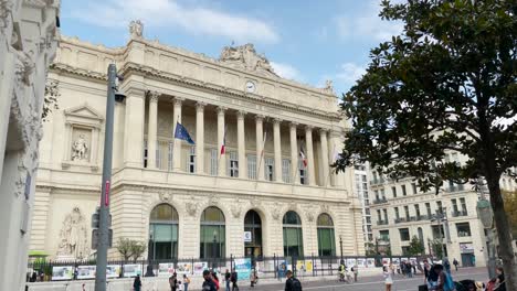 Static-view-of-Palais-de-la-Bourse-and-people-on-street-in-Marseille