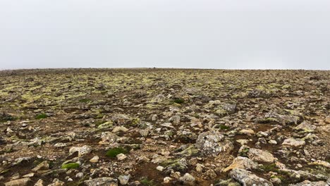 Sparse-Icelandic-tundra-landscape-with-overcast-skies-and-rocky-terrain,-vast-open-space