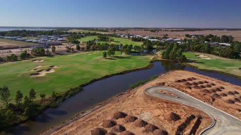 Yarrawonga,-Victoria,-Australia---8-March-2024:-Loading-a-tip-truck-on-the-new-stage-construction-site-at-Silverwoods-Estate-in-Yarrawonga