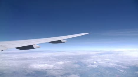 Long-Slick-Airplane-Wing-in-Flight,-Passenger-View-from-the-Window