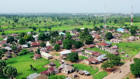 Pila-village-rural-farming-community-in-Nigeria,-West-Africa---rising-aerial-landscape-reveal