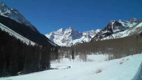 Aspen-Snowmass-Maroon-Bells-spring-winter-avalanche-ranch-snowmobile-trail-Rocky-Mountains-Colorado-Capital-peak-blue-sky-incredible-peace-sunny-scenic-landscape-Crested-Butte-pan-slowly-to-the-left