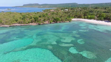 Aerial-view-of-beautiful-La-Playita-beach-in-Las-Galeras-on-the-Samaná,-Dominican-Republic