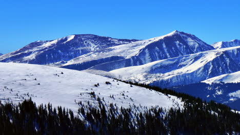 Winter-Quandary-Peak-fourteener-Ten-Mile-Range-Breckenridge-Colorado-aerial-drone-Boreas-Hoosier-Pass-Blue-River-Mt-Lincoln-clear-blue-sky-morning-Rocky-Mountain-landscape-upward-pan-left-movement