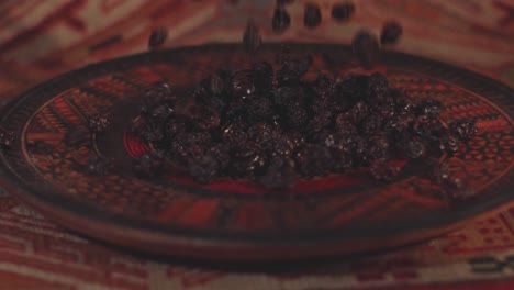 Dried-raisins-are-thrown-into-a-beautifully-decorated-serving-dish