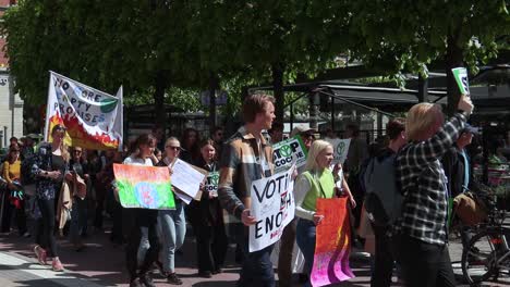 Slo-mo-of-protesters-with-signs-at-march-for-environment-in-Stockholm