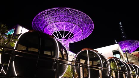 Futuristic-Dubai-UAE-at-Night,-Super-Trees-and-Capsules-in-Coffee-Shop-on-Bluewater-Island