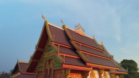 Traditional-beautifully-decorated-Laos-architecture,-arched-roof-on-old-temple-pagoda