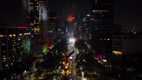 Illuminated-El-Ángel-monument,-New-Years-celebration-in-Mexico-city---Aerial-view