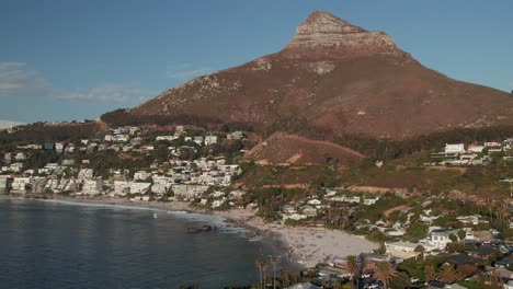 Cape-Town,-South-Africa---The-Waterfront-Suburb-of-Clifton-Beach-with-Lion's-Head-Mountain-in-the-Background---Aerial-Drone-Shot