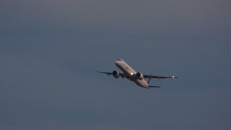 -Airplane-from-branded-company-flying-over-a-cloudy-sky-near-another-plane,-over-Toronto,-Canada