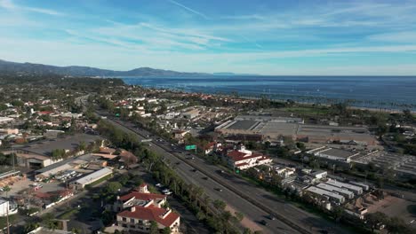 Pullback-drone-shot-over-the-101-highway-in-Santa-Barbara-with-traffic