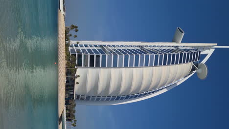 Vertical-Video,-Burj-Al-Arab,-Iconic-Hotel-and-Skyscraper-on-Waterfront-of-Dubai-UAE