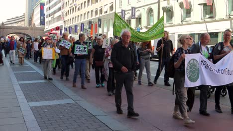 Protesters-march-with-Parents-for-Future-banner-at-climate-rally