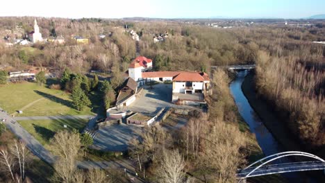 Lavka-Pod-Hradem-Bridge-On-Lucina-River-Near-Silesian-Ostrava-Castle-During-Fall-Season-In-Czech-Republic