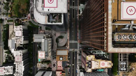 Cenital-drone-shot-rising-in-front-of-the-Wells-Fargo-building-in-downtown-Los-Angeles