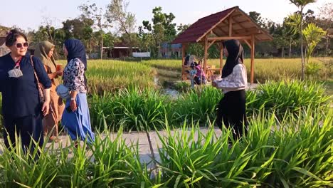 People-visiting-the-historical-tourist-spot-of-a-local-hero-named-Noyo-Gimbal-in-Bangsri-village,-Blora,-Indonesia