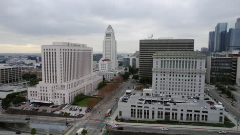 Drone-Shot,-Los-Angeles-City-Hall,-Courthouse,-Hall-of-Justice,-Highway-and-Spring-Street-Traffic,-California-USA