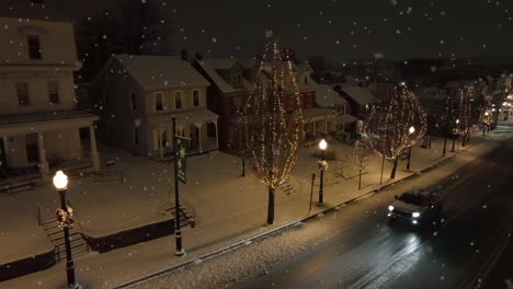 Quaint-small-town-with-snow-flurries-and-Christmas-lights-during-dawn