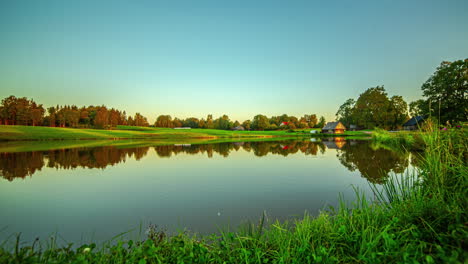 Sky-and-entire-landscape-are-reflected-in-water,-timelapse