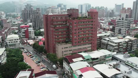 Aerial-of-Guandu-Hospital-in-Taipei--Taiwan-on-a-cloudy-day