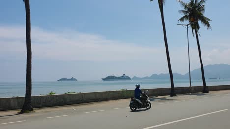 Ocean-view-of-two-cruise-ships-arriving-with-tourist-on-vacation-for-a-day-trip-and-waterfront-traffic-in-the-capital-city-of-East-Timor,-Southeast-Asia