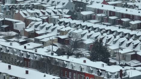 Beautiful-crowded-row-of-houses-with-colorful-facade-during-snowy-winter-day-in-American