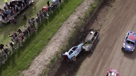 Aerial-view-of-old-cars-racing-on-dirt-track,-Friesland,-Netherlands