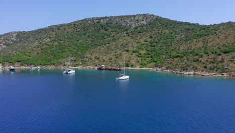 Aerial:-Slow-panning-drone-shot-of-Peristera-island-shipwreck-near-Alonnisos,-Sporades,-Greece-during-summer