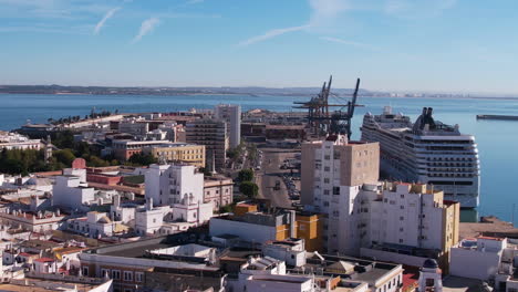 Aerial-View-of-MSC-Armonia-Cruise-Ship-in-Port-of-Cádiz-Spain-and-Coastal-Neighborhood,-Drone-Shot