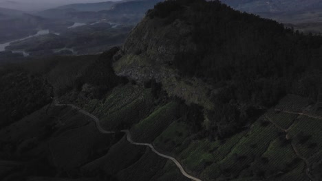 Aerial-drone-view-camera-moving-towards-the-side-where-there-are-big-fields-and-big-mountains-and-also-many-different-big-rivers