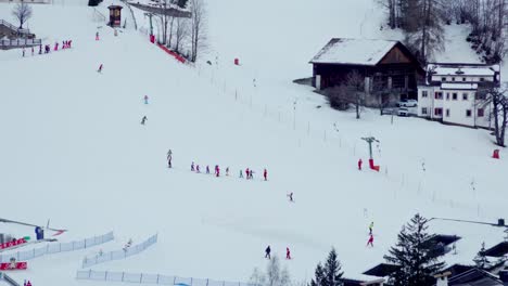 People-learn-how-to-ski-on-a-ski-slope-for-beginners