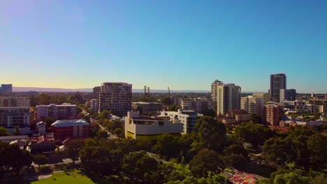 Beautiful-aerial-sunrise-over-East-Perth-apartment-buildings-and-park-with-rolling-hills-in-the-distance