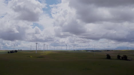 4k-Slow-motion-aerial-footage-of-windmills-over-agricultural-land-in-california