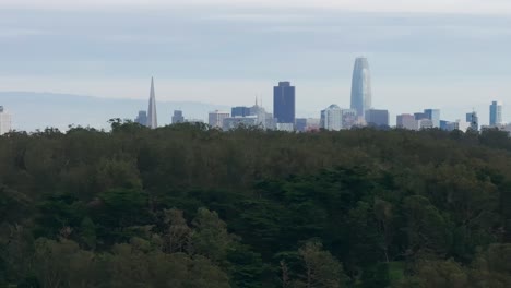 Drone-telephoto-shot-panning-upward-and-revealing-San-Francisco-skyline