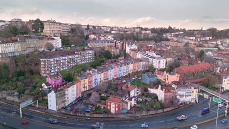 Aerial-riser-view-over-colourful-Hotwells-houses,-Clifton-on-hill,-Bristol