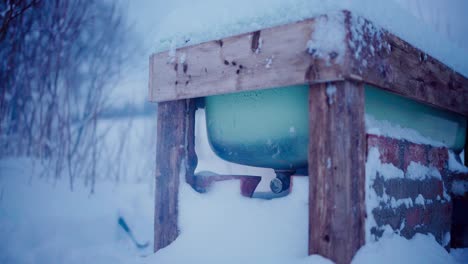 Steaming-Diy-Hot-Tub-Outdoor-During-Freezing-Winter-Season