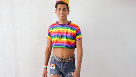Young-latino-gay-man-wearing-short-jeans-and-rainbow-LGBTQ-outfit