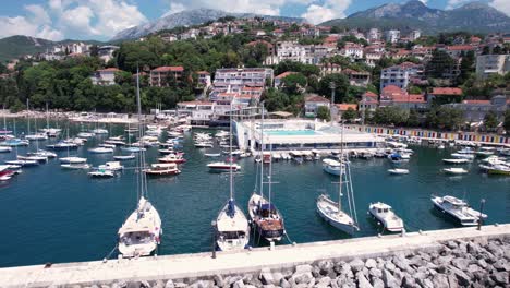 Aerial-View-of-Herceg-Novi-Harbor,-Montenegro,-Sailing-Boats-and-Yachts-in-Marina,-Drone-Shot