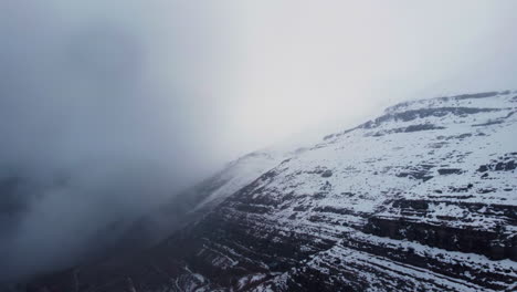 Snow-clouds-over-the-mountains-Aerial