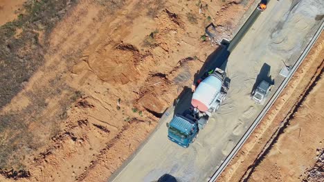 Yarrawonga,-Victoria,-Australia---8-March-2024:-Concrete-truck-and-workers-laying-the-foundation-for-a-new-kerb-on-a-road-at-Silverwoods-Estate-in-Yarrawonga