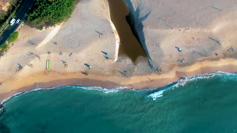 tilt-up-from-beach-sand-and-waves-to-mountain-valley-view