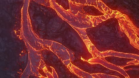 Close-up-aerial-cinematic-footage-captured-by-a-4K-drone-showcases-cascading-lava-gliding-in-slow-motion