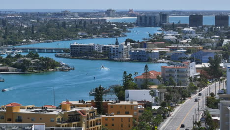 Establishing-shot-drone-long-shot-of-Florida-Introcoastal-waterway-and-luxury-real-estate-and-boat-car-traffic