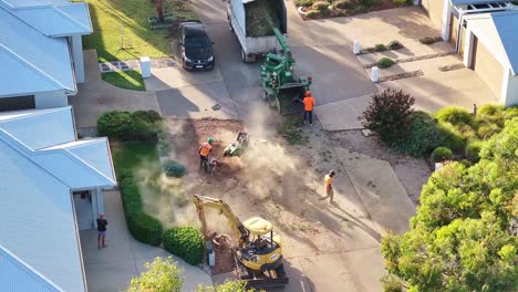 Yarrawonga,-Victoria,-Australia---6-March-2024:-Clearing-the-stump-area-with-a-blower-prior-to-stump-grinding-in-a-suburban-street