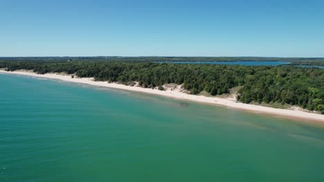 Drone-aerial-view-of-whitefish-dunes-state-park-shoreline-on-a-windy-day