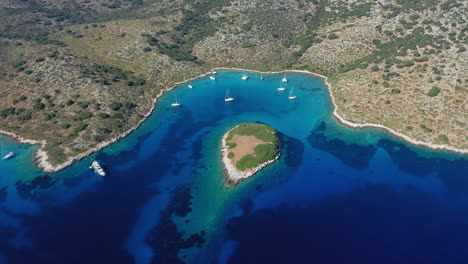 Aerial:-Flying-towards-the-bay-of-the-island-of-Kira-Panagia-in-Northern-Sporades,-Greece
