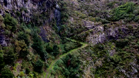 "Embark-on-a-virtual-hike-along-the-scenic-trails-of-Madeira,-with-the-drone-offering-a-bird's-eye-view-of-the-island's-natural-wonders